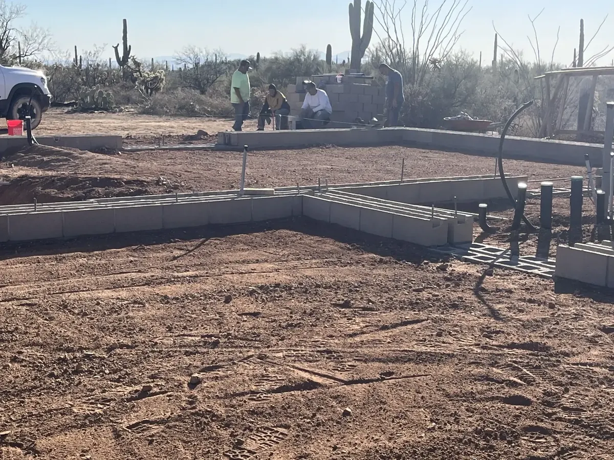 Building footprint with foundation forms and exposed site preparation